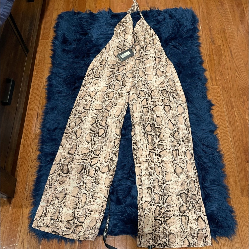 Brand New Snake Print Jumpsuit (Fits a size 10-12), elastic waist